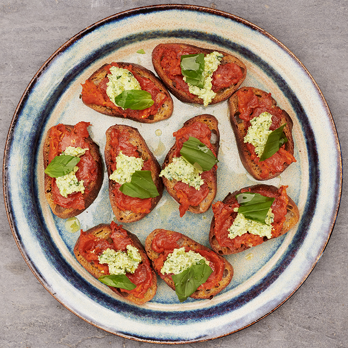 Sobrasada toasts with broad beans and ricotta, photographed by Joe Woodhouse