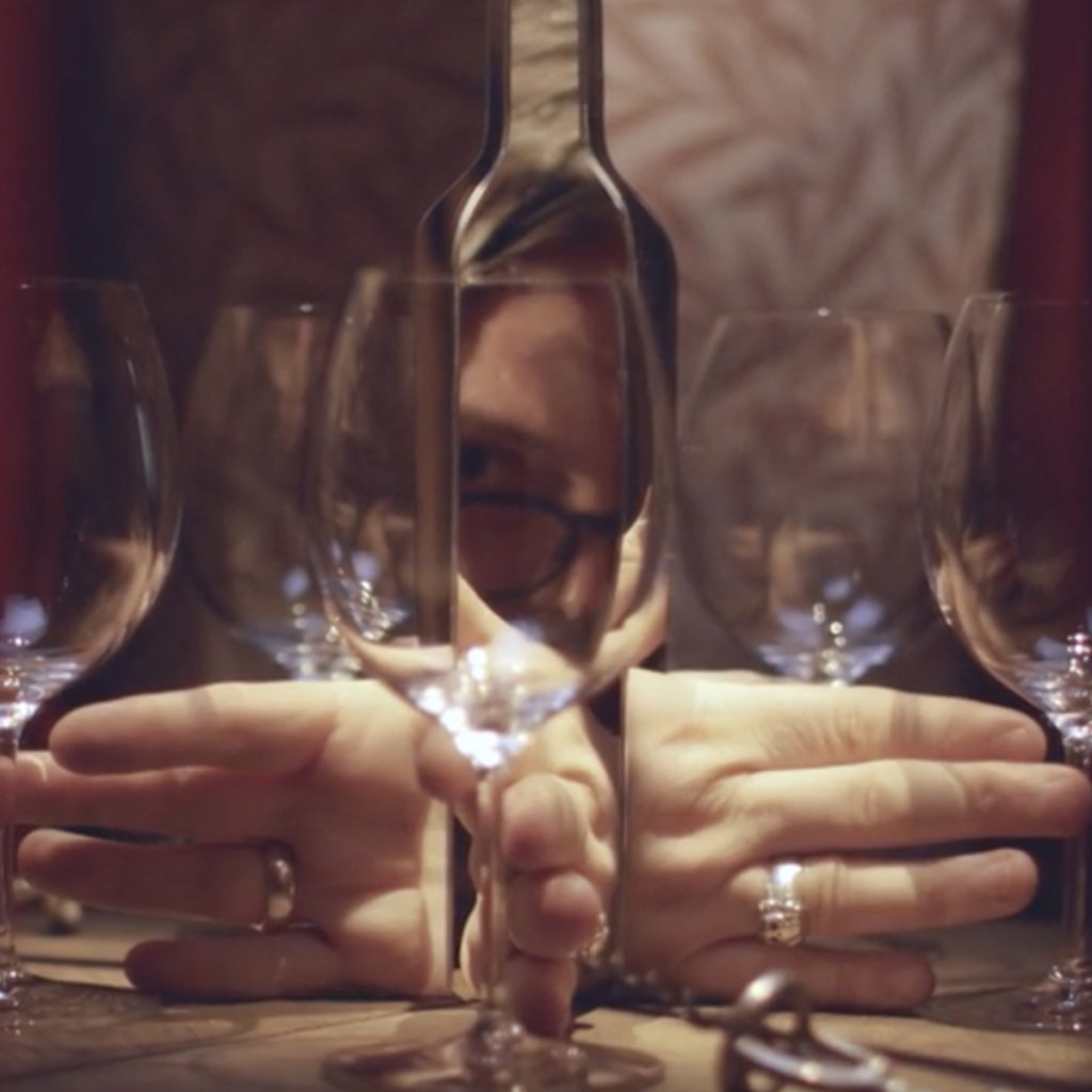 The technique used by filmmakers Iain and Jane in 2019 involved mirrors to create illusions of multiple wine glasses